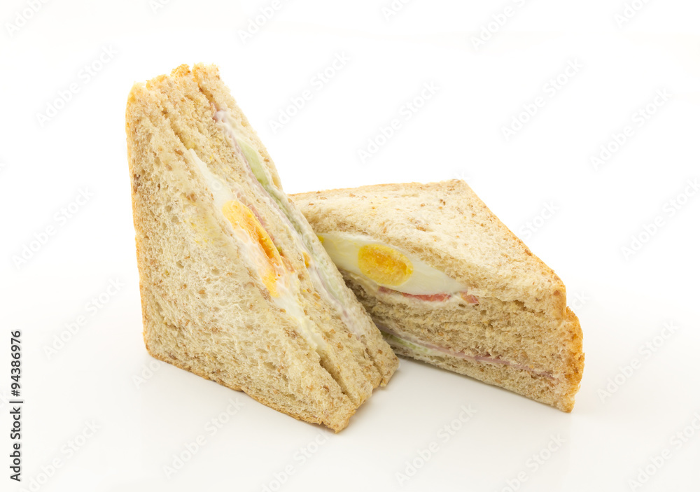 egg and ham sandwich on white background