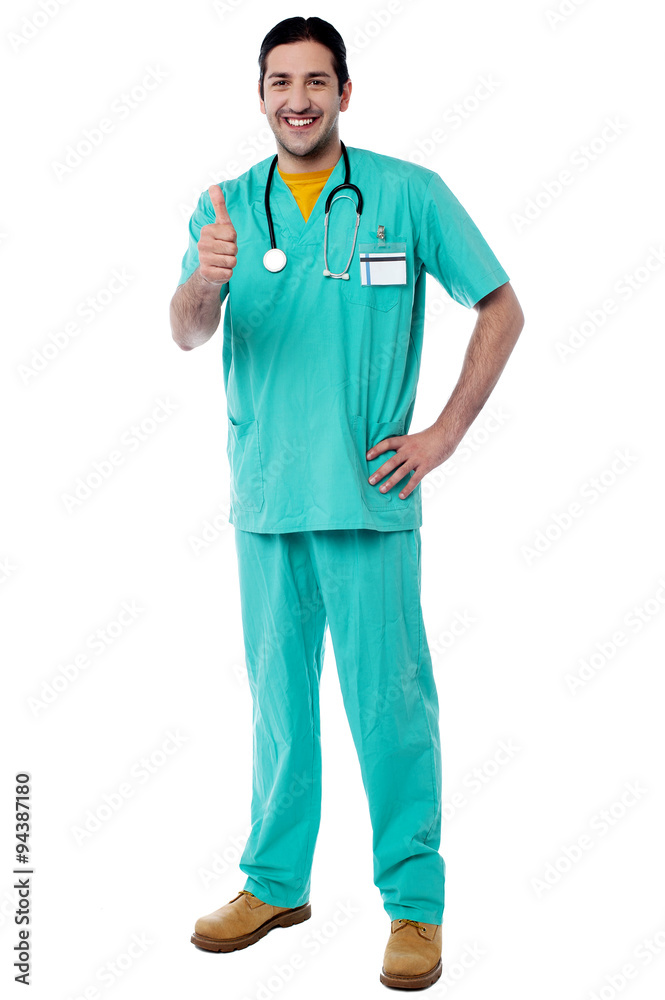 Smiling doctor showing thumbs up Smiling doctor showing thumbs up