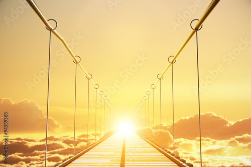 Wooden bridge in the clouds going to sunset, concept photo