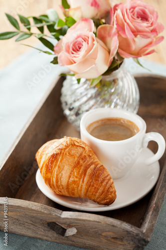 Romantic breakfast with coffee and croissant