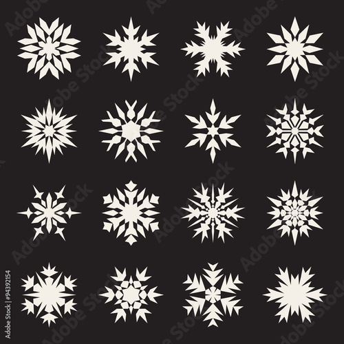 Set of Sixteen Symmetrical White Snowflakes Design on Black Background