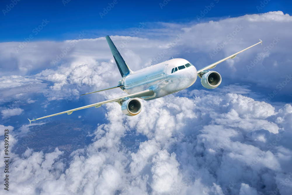 Airplane in the sky against cloudy Airplane in the sky against cloudy