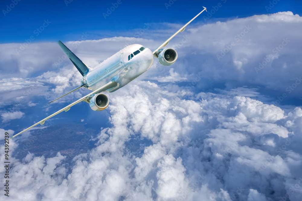 Airplane in the sky against cloudy Airplane in the sky against cloudy