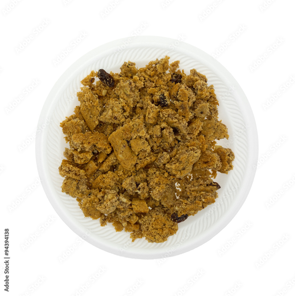 Crumbled oatmeal raisin cookies on a white plate