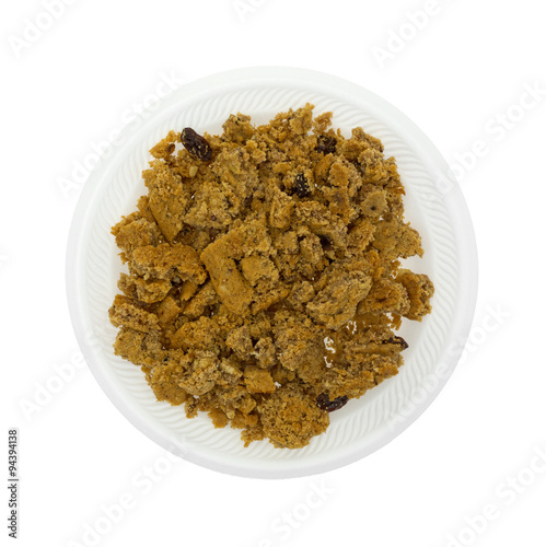 Crumbled oatmeal raisin cookies on a white plate