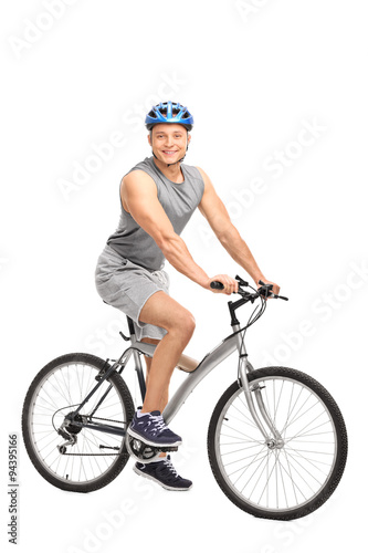 Man with a blue helmet sitting on his bike