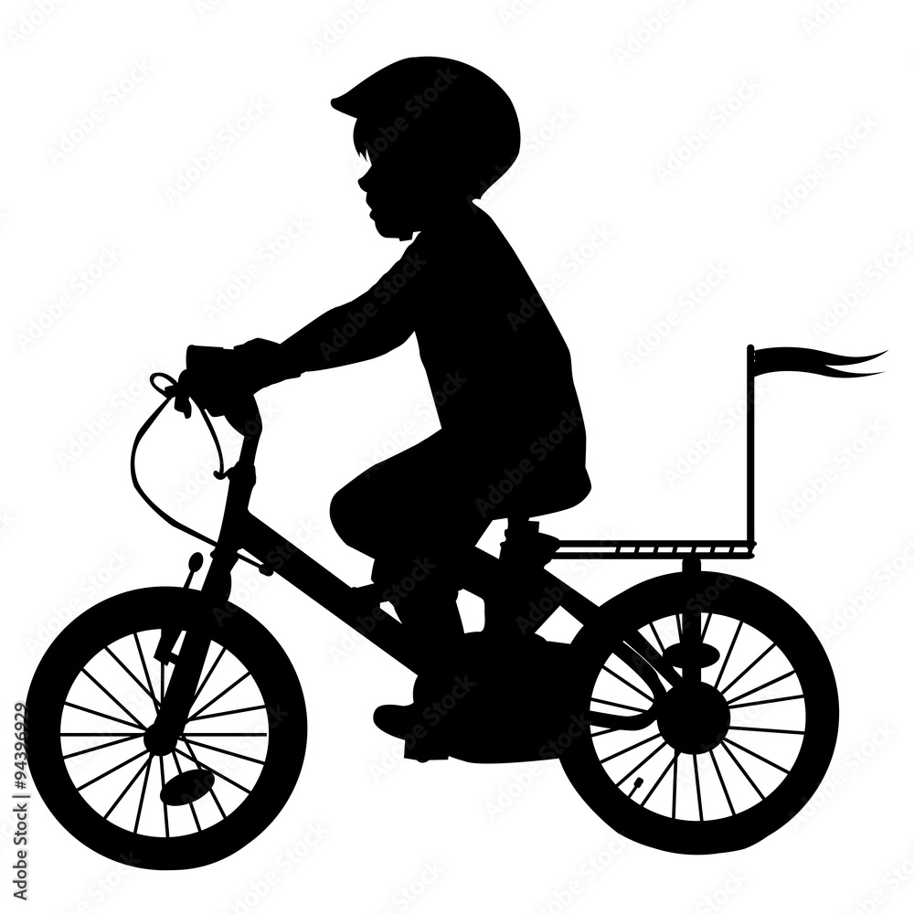 Fototapeta premium A boy rides a bicycle with flag
