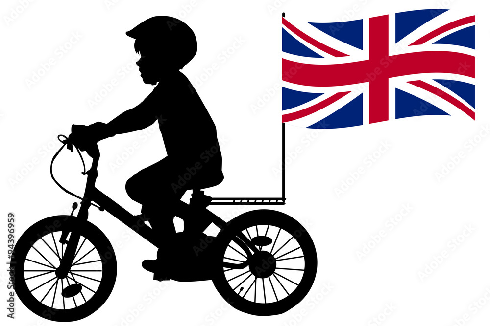 Fototapeta premium A kid silhouette rides a bicycle with United Kingdom flag