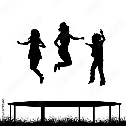 Children jumping on garden trampoline