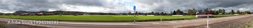 Panoramic view of field and houses at the highway near Aeppelbo, Dalarna, Sweden photo