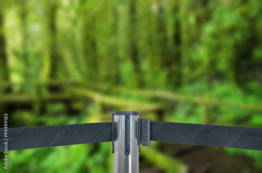 Barricade with green forest (do not entry) as blur background Barricade with green forest (do not entry) as blur background