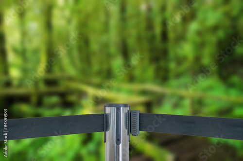 Barricade with green forest (do not entry) as blur background