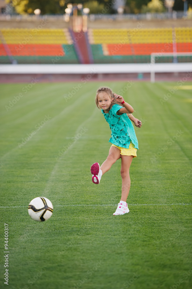 little funny girl on football stadium little funny girl on football stadium