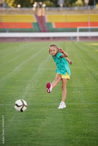 little funny girl on football stadium