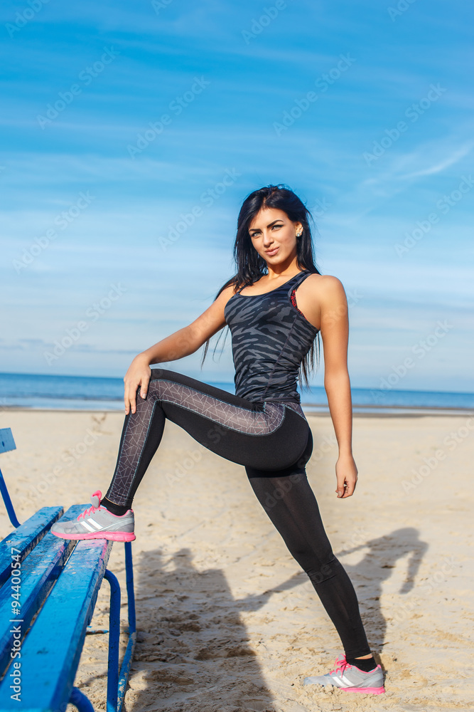 Woman in sportswear doing flexible exercises. Woman in sportswear doing flexible exercises.