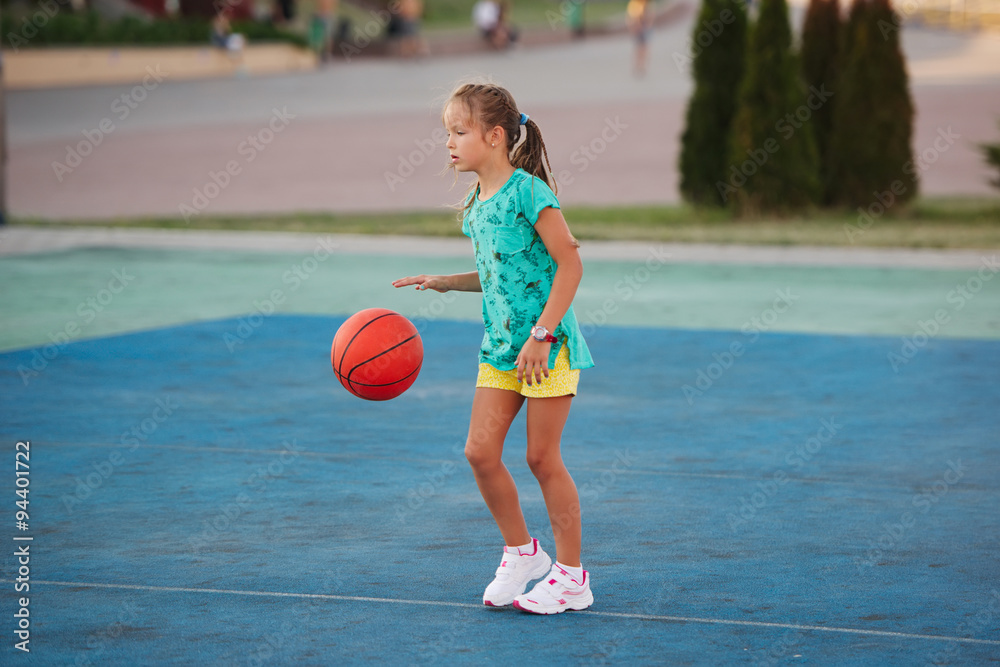 little cute girl playing basketball outdoors little cute girl playing basketball outdoors
