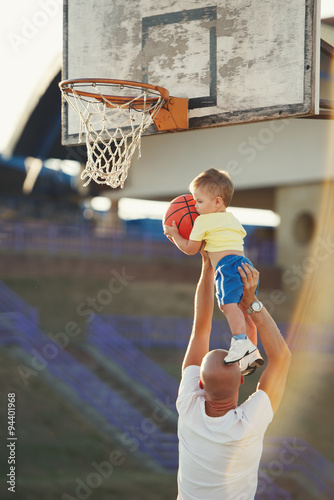 father and son playing basketball © Aliaksei Lasevich