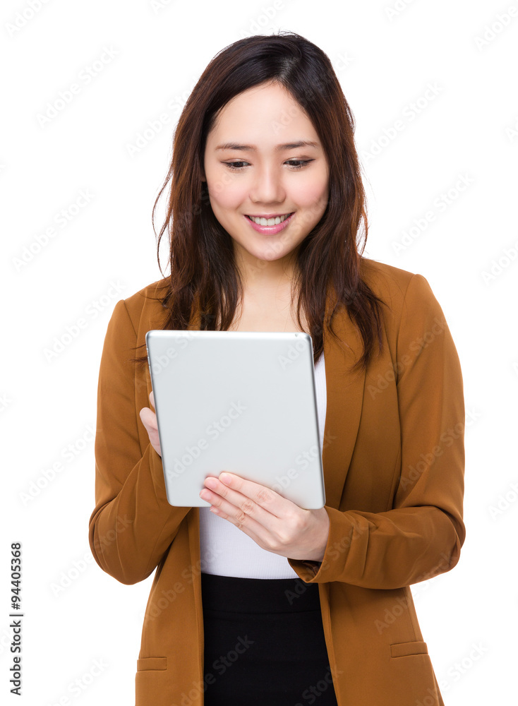 Asian Young Buisnesswoman use of the tablet pc Asian Young Buisnesswoman use of the tablet pc