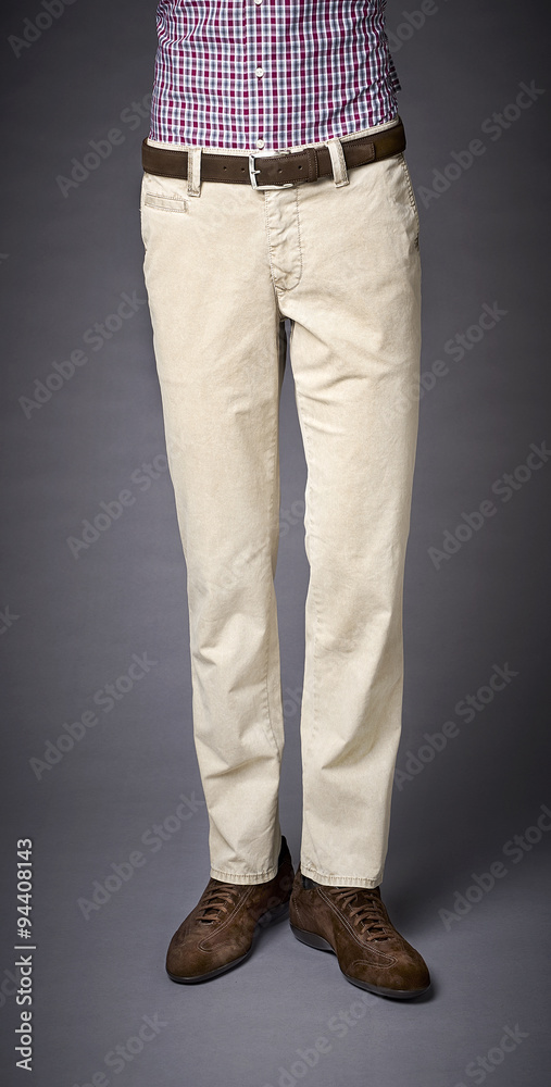 mans pants on a grey back ground mans pants on a grey back ground