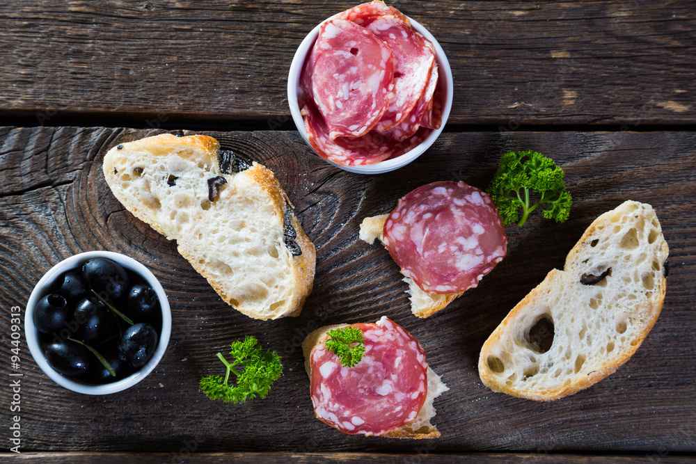 Bread with black olives salami, Italian snacks Bread with black olives salami, Italian snacks