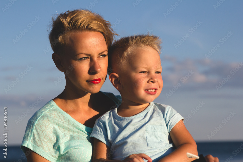 Happy family resting at beach in summer Happy family resting at beach in summer