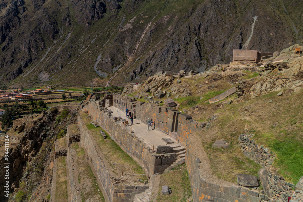Tourists visit ruins in Ollantaytambo, Sacred Valley of Incas, Peru