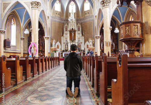 Man kneeling at the alter