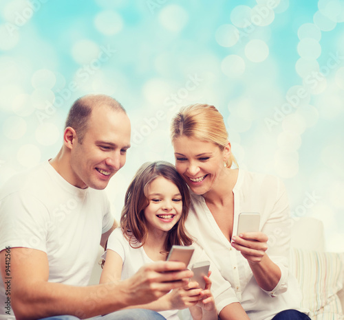 happy family with smartphones