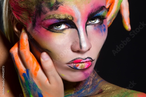 Foto Halloween. Woman with creative make up.