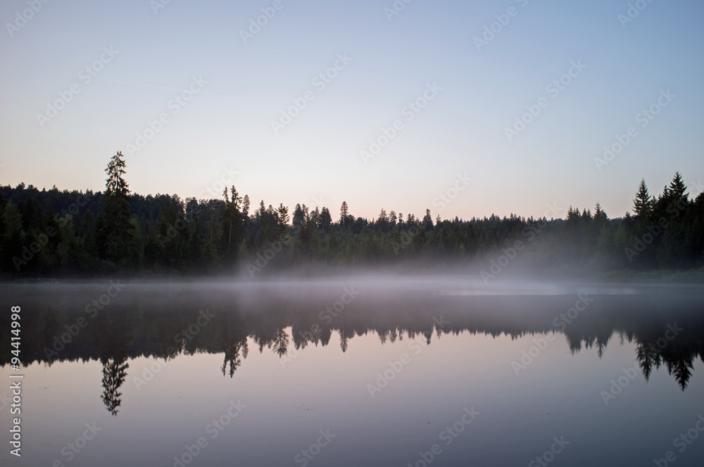 Fototapeta premium beautiful lake with mist early in the morning