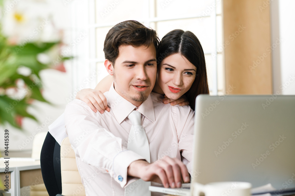 happy young relaxed couple working on laptop computer happy young relaxed couple working on laptop computer