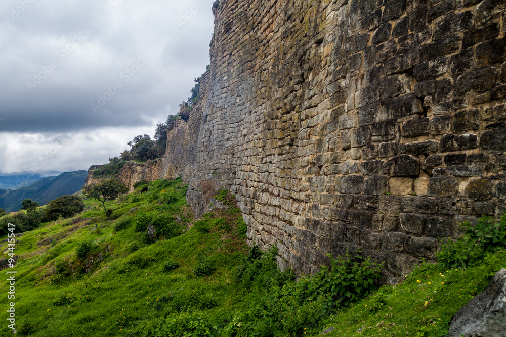 Stone wall of Kuelap, ruined citadel city of Chachapoyas cloud forest culture in mountains of northern Peru.