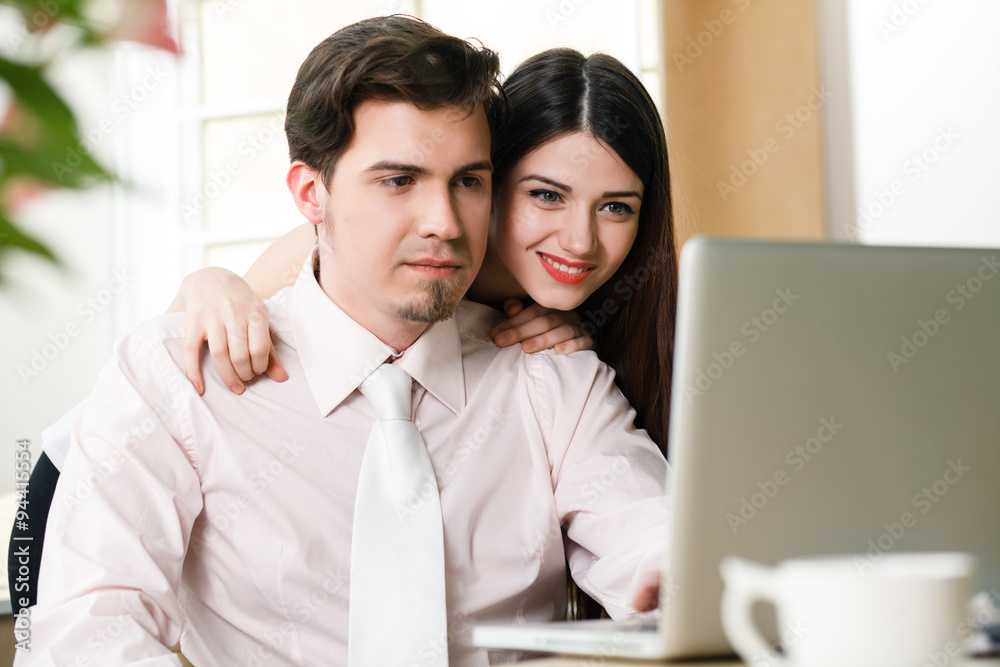 happy young relaxed couple working on laptop computer happy young relaxed couple working on laptop computer