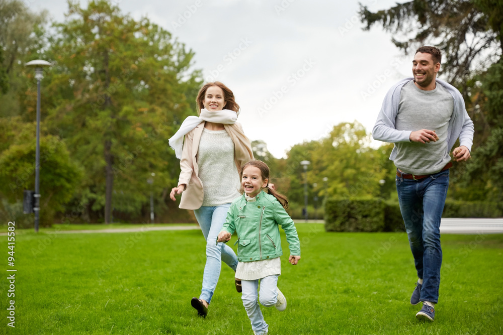 happy family walking in summer park