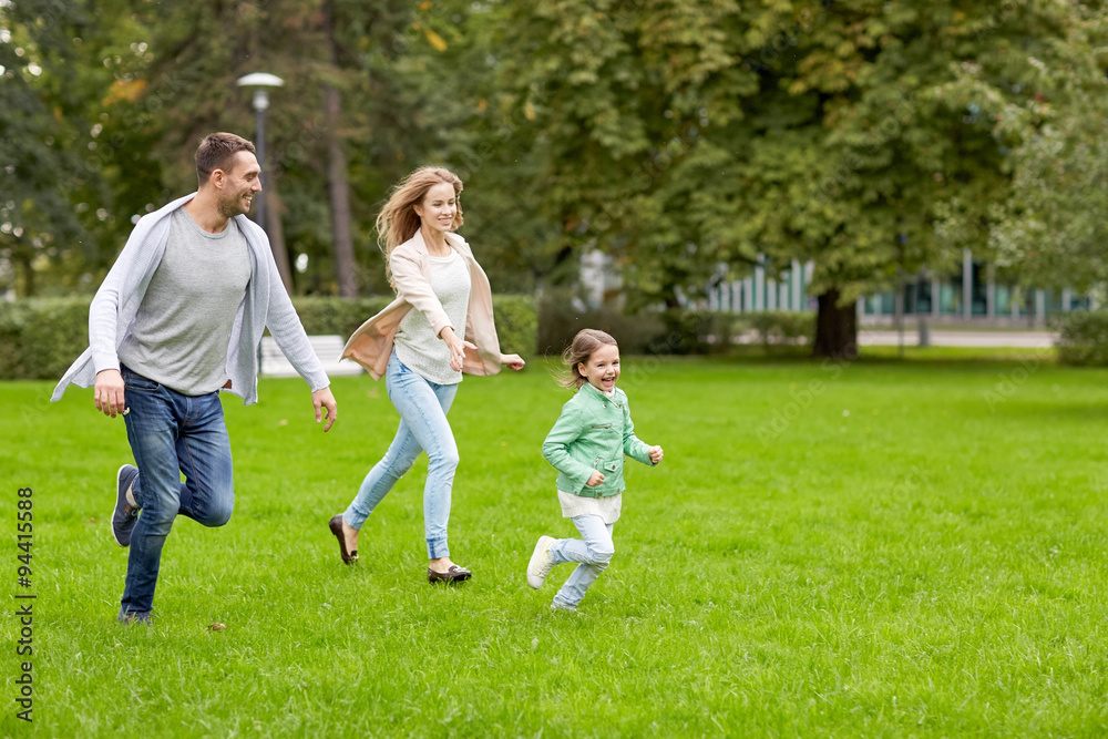 happy family walking in summer park