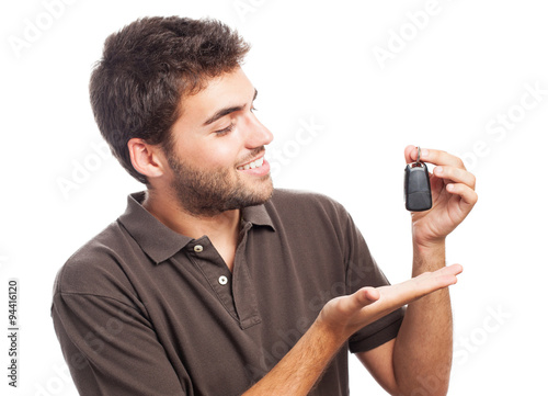 young man with the keys of his new car photo