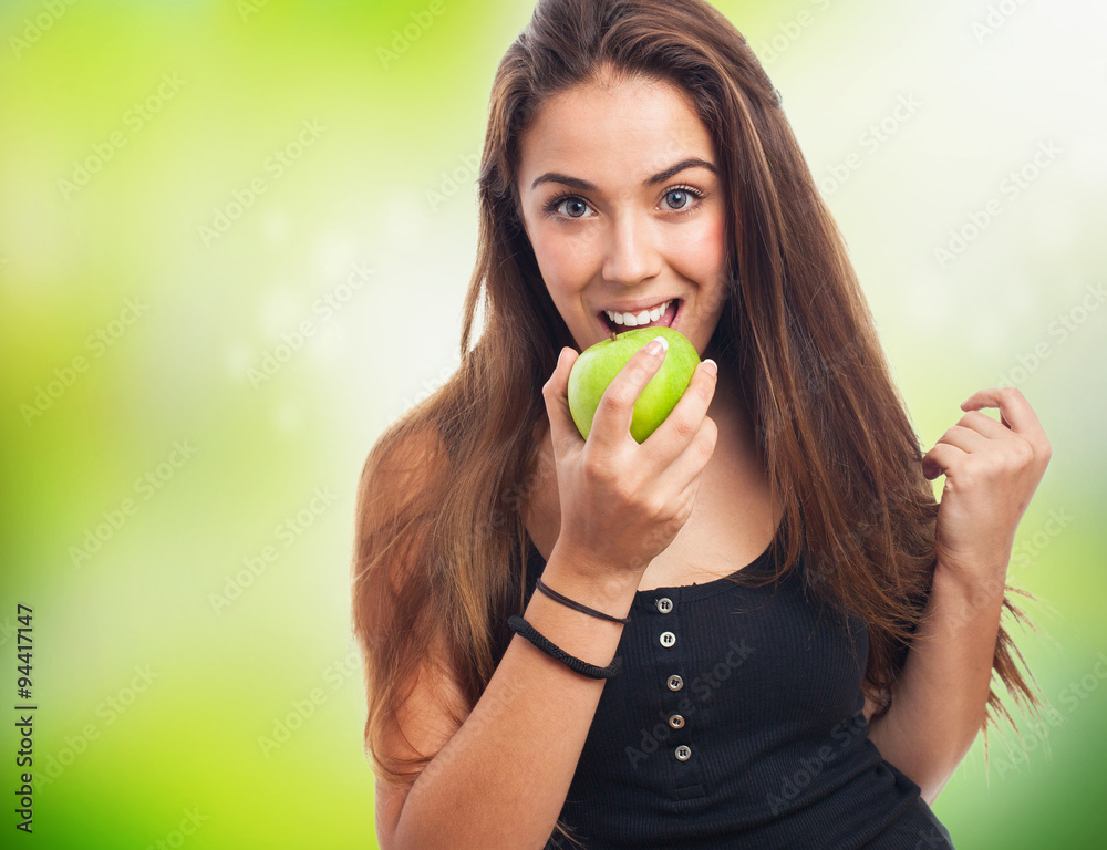 portrait of woman eating a geeen apple portrait of woman eating a geeen apple