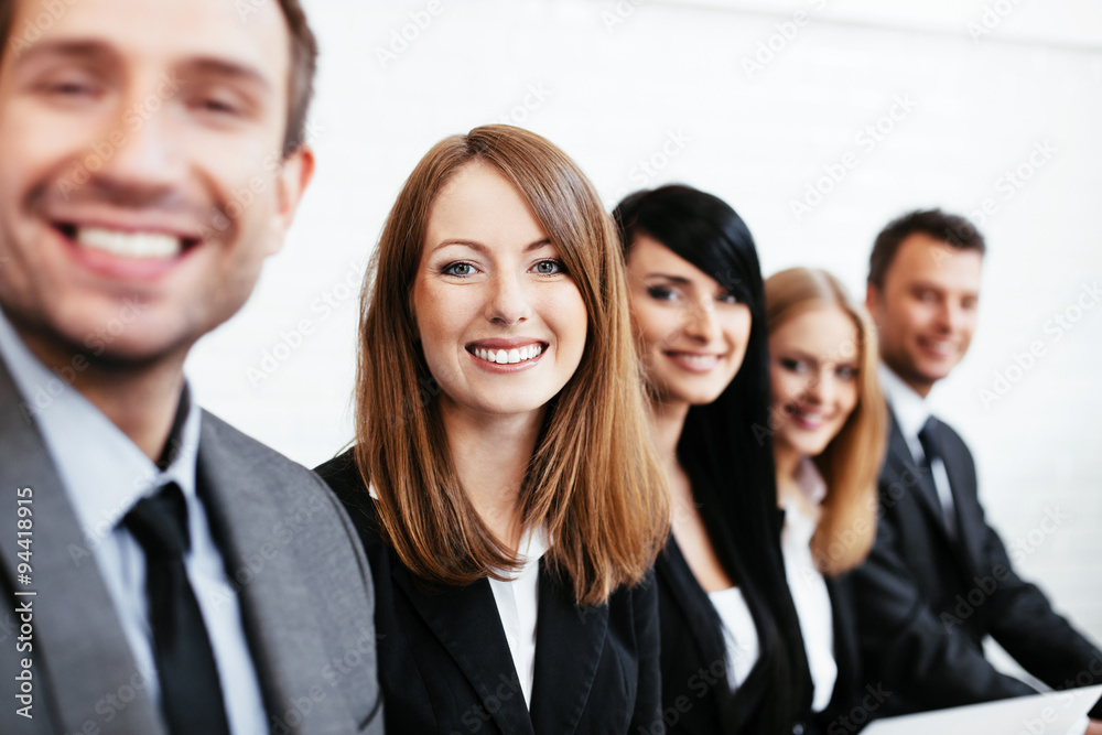 Young businesswoman sitting with business partners. Human resources concept Young businesswoman sitting with business partners. Human resources concept
