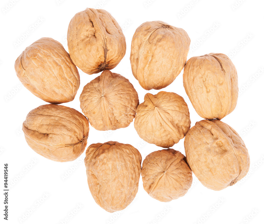 heap of walnuts isolated on a white background heap of walnuts isolated on a white background