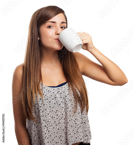 young woman holding a mug isolated on white