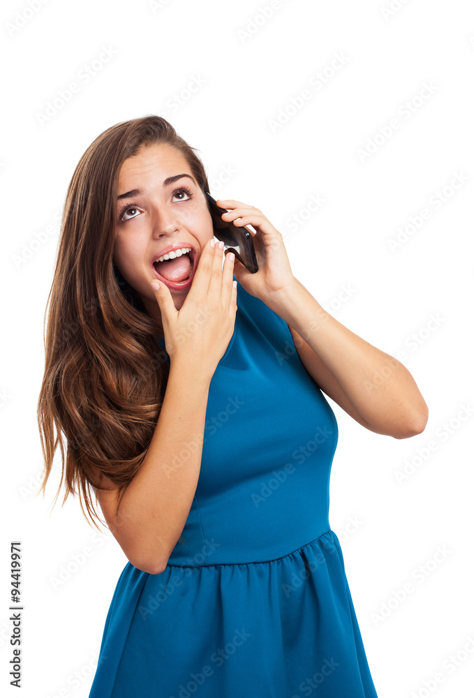 portrait of young woman wearing a dress talking with a mobile on portrait of young woman wearing a dress talking with a mobile on