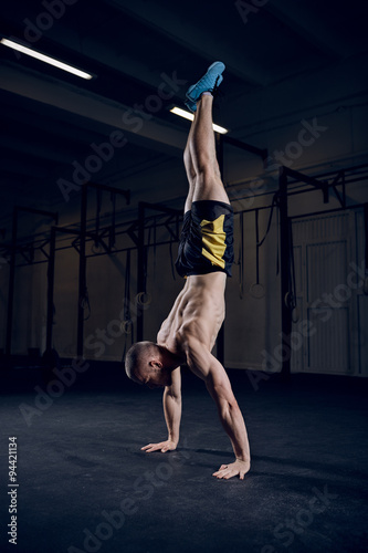 Athlete standing on hands during bodyweight workout