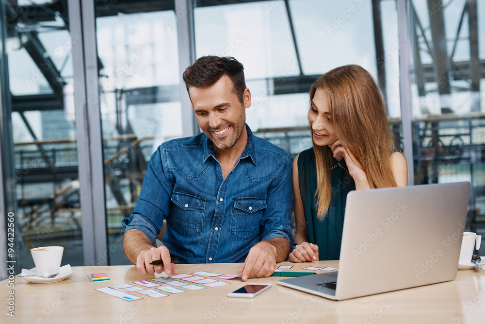 Happy web designers creating responsive design mockup Happy web designers creating responsive design mockup