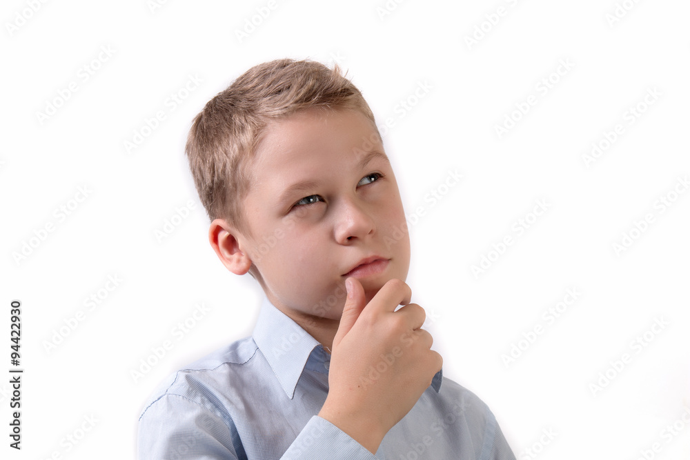 portrait of a little schoolboy in a pensive pose isolated on white background portrait of a little schoolboy in a pensive pose isolated on white background
