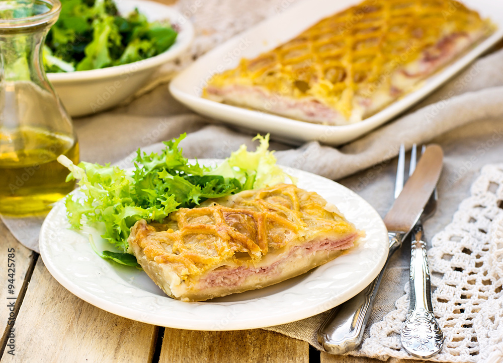 Puff pastry pasty with bechamel sauce, ham and cheese Puff pastry pasty with bechamel sauce, ham and cheese
