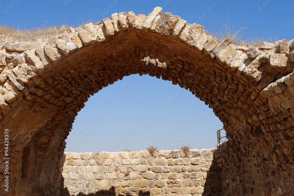 Ancient stone arch and wall of Kerak Castle in Jordan