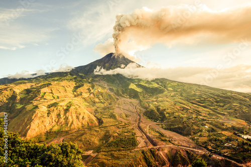 A dramatic eruption of the active Tungurahua volcano in Ecuador sends a massive cinder cloud into the sky, captivating locals with its volcanic power.