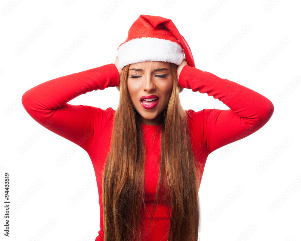 portrait of a beautiful young woman at Christmas covering her ears with hands portrait of a beautiful young woman at Christmas covering her ears with hands
