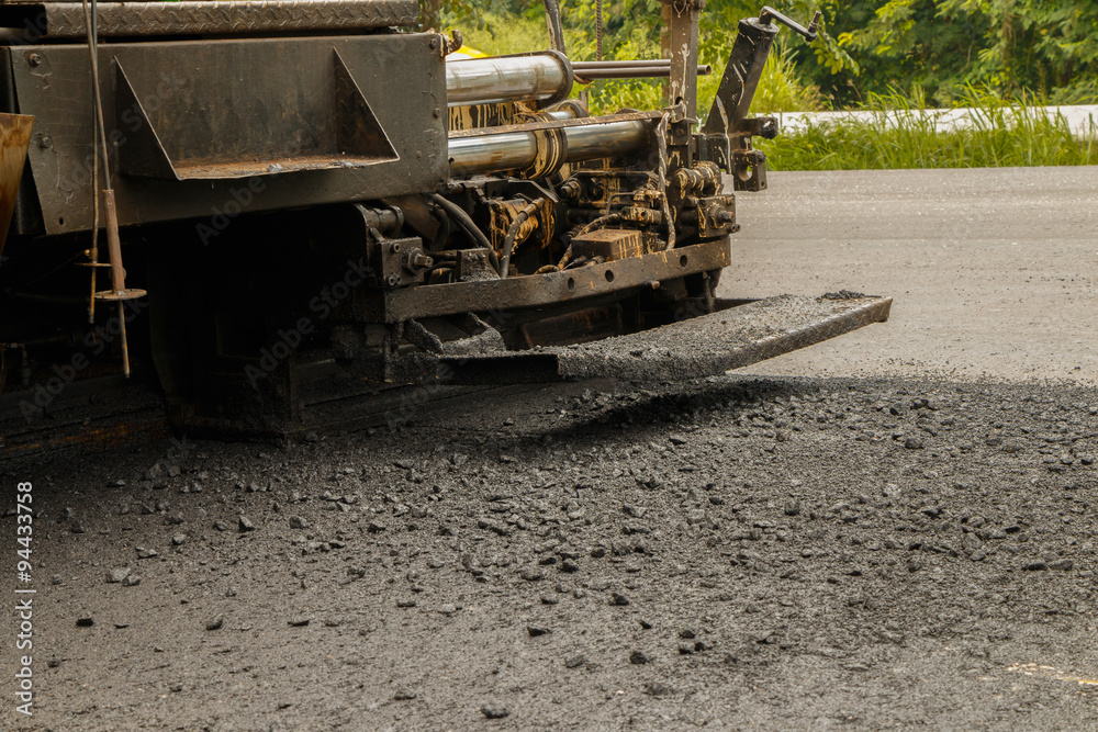 Obraz premium Asphalt spreader in work on site.