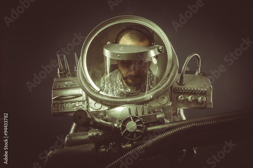 Fiction, spaceman with plasma gun and helmet glass